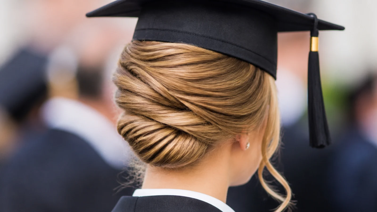 Hair rolled vertically against the back of the head and pinned along a seam