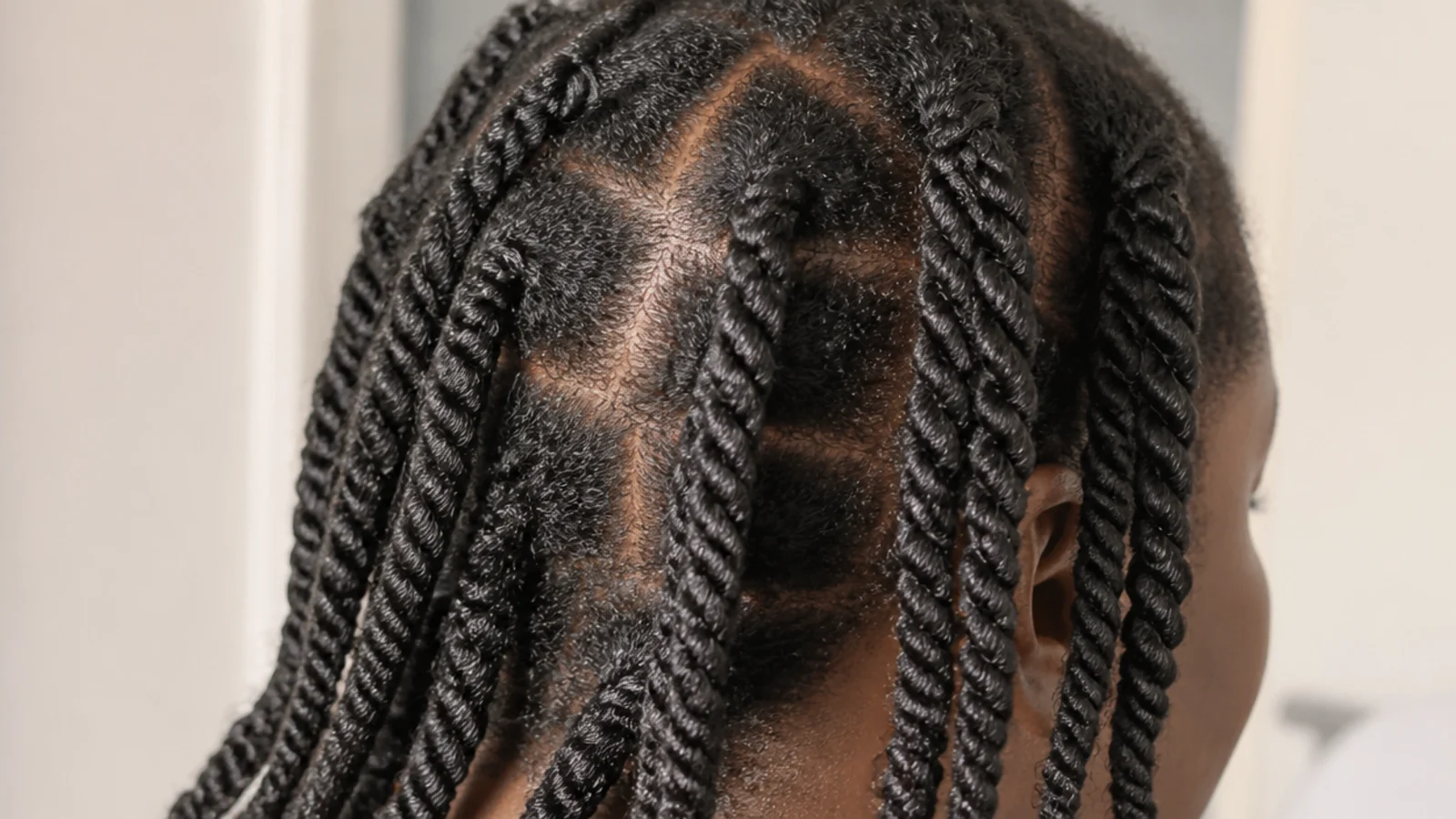 Chunky two strand twists drying across the back of the head