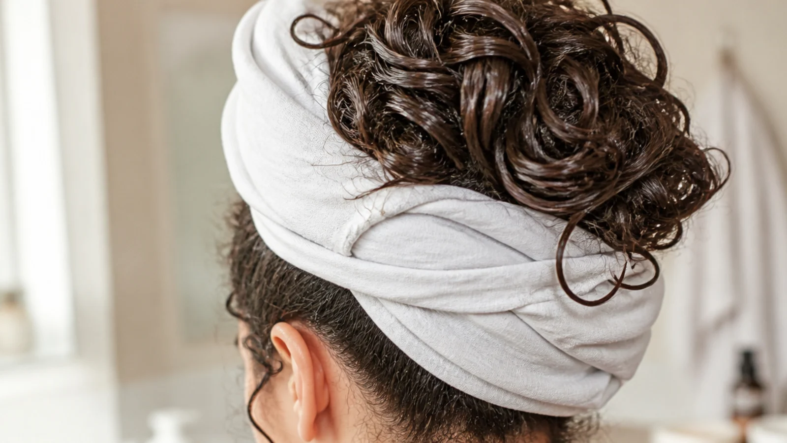 Curls piled into a cotton t shirt wrapped at the nape