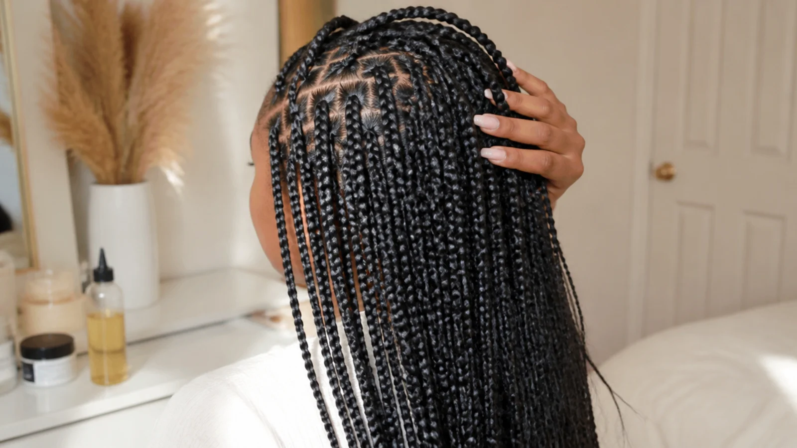 Neat braids started well back from a smooth hairline