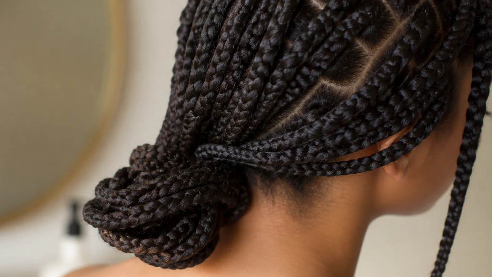 Braids gathered neatly at the back of the head
