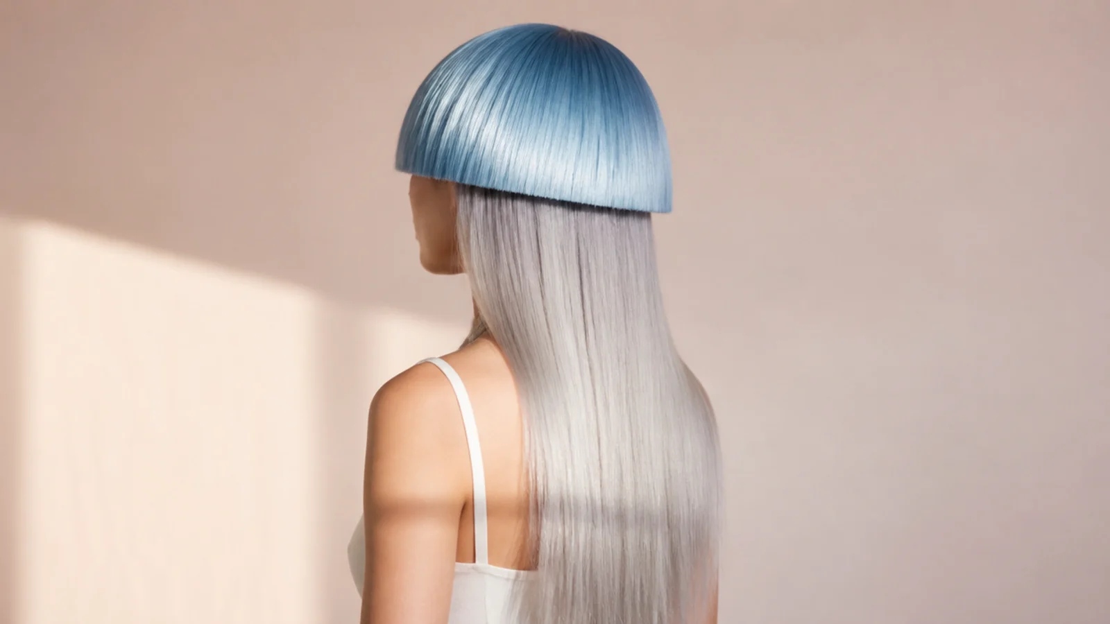 A steel blue top layer with a metallic sheen sitting over dark unbleached lengths