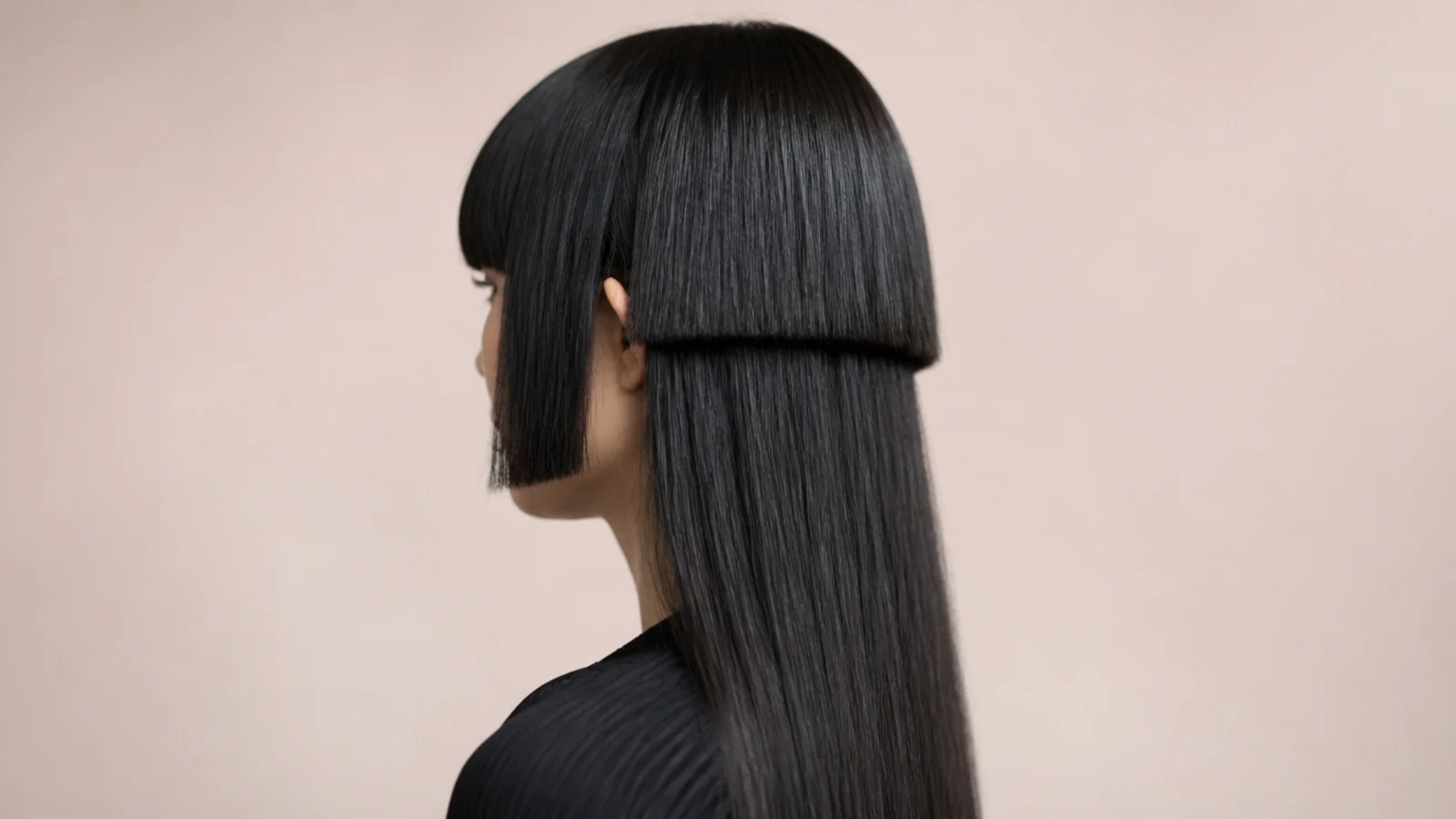 Straight side panels cut at cheekbone height framing the face above a stepped shape