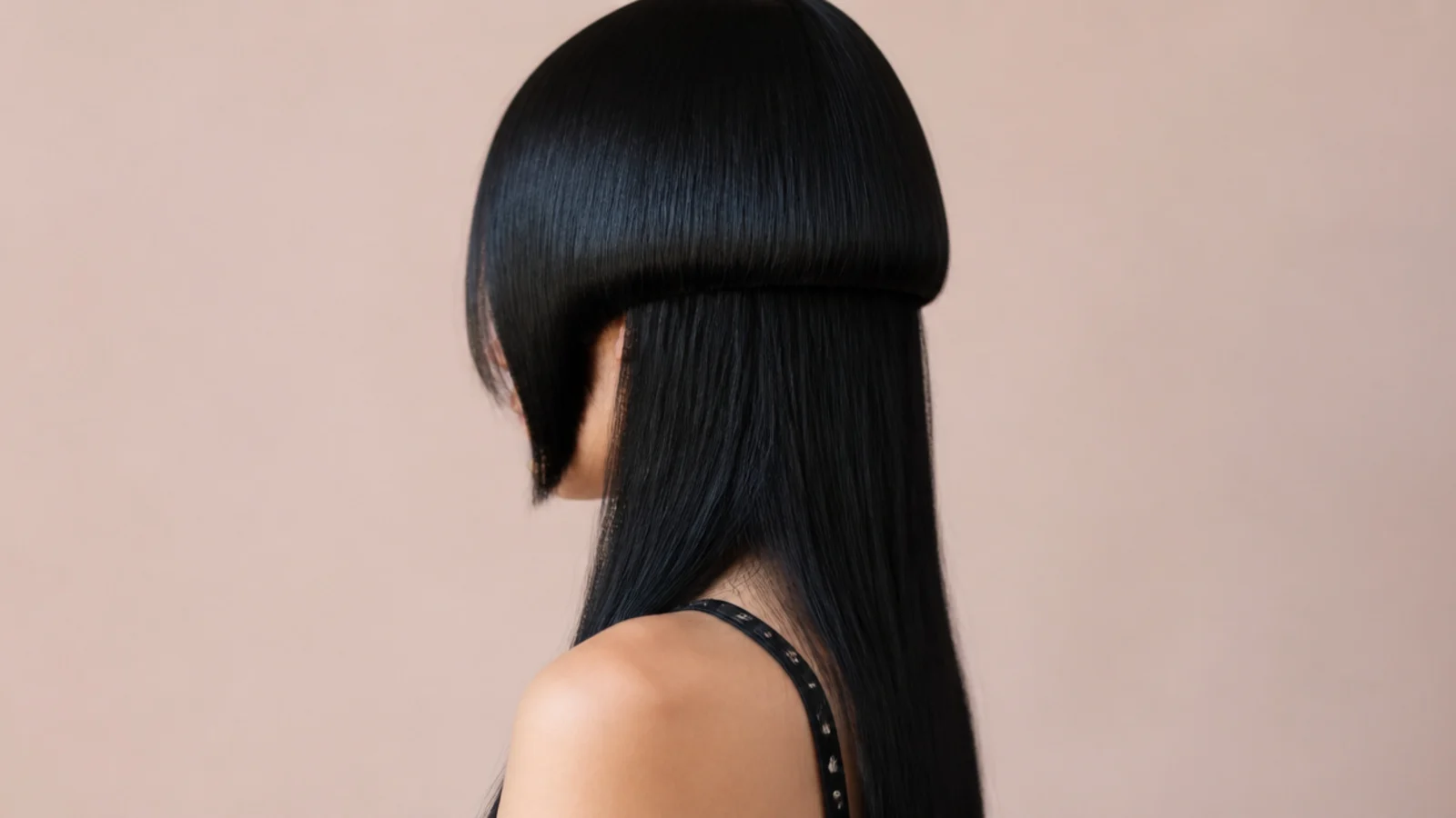 Near black hair with a cool blue sheen along the edge of the rounded top layer