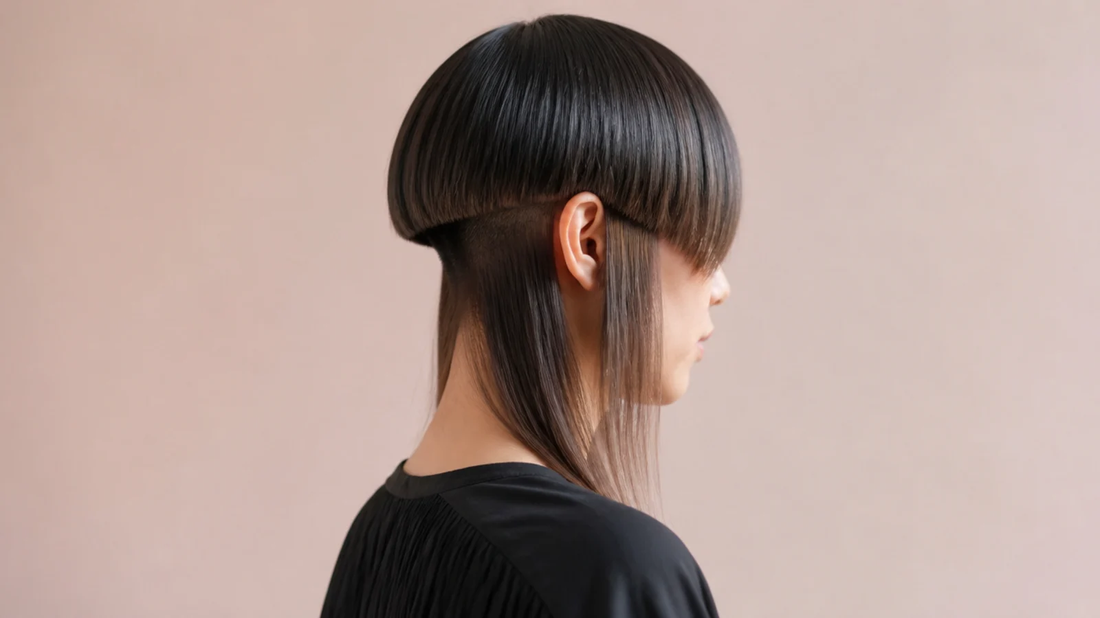 Long hair lifted to reveal a clipped section at the nape underneath