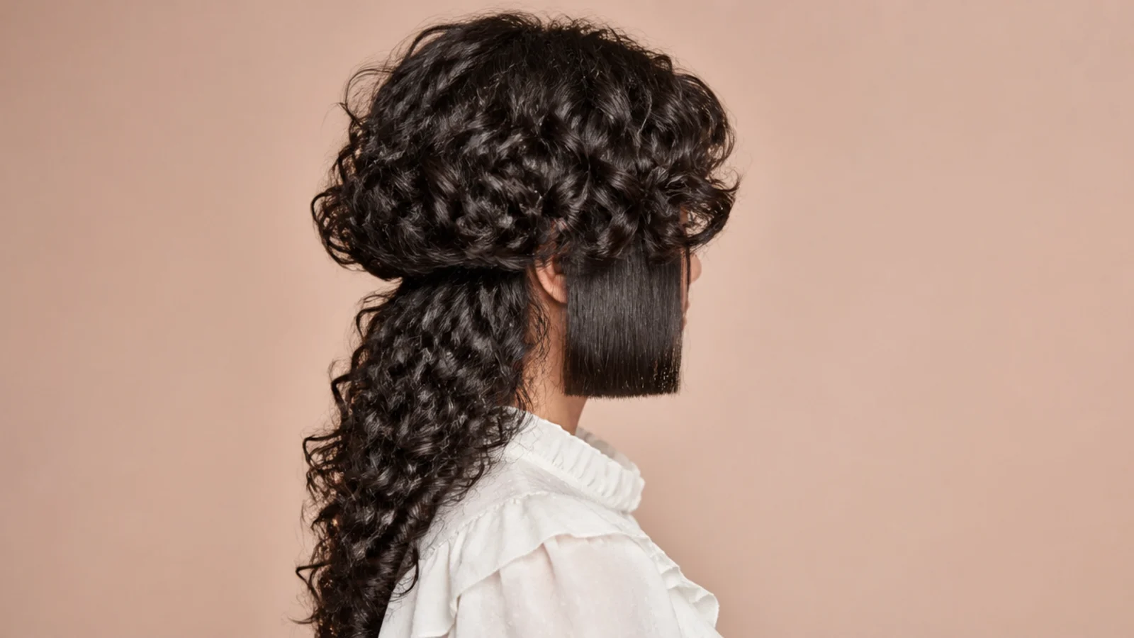 Two straight smoothed side sections framing a curly rounded top layer