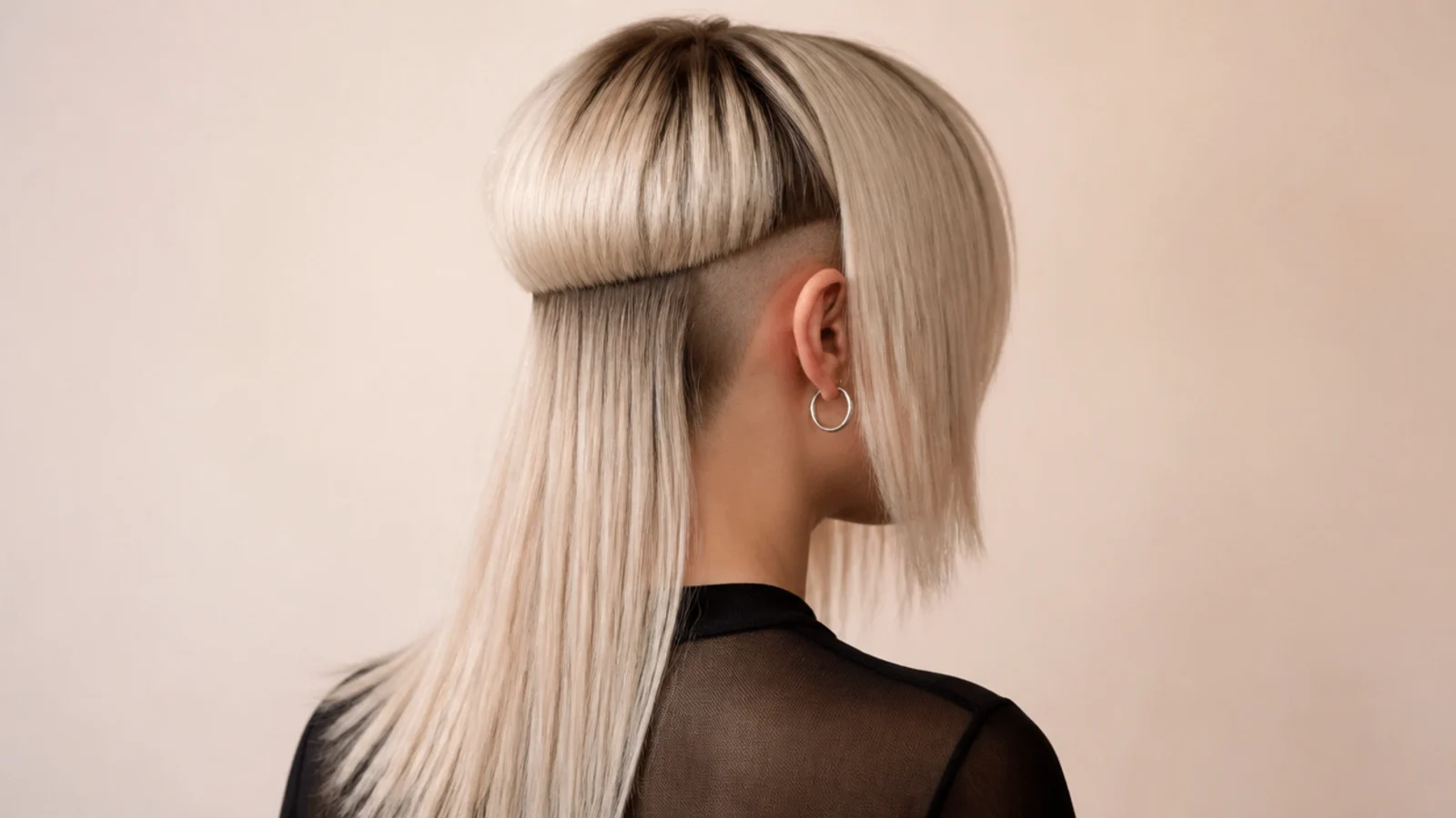 A closely shaved panel above one ear with hair tucked back to expose it