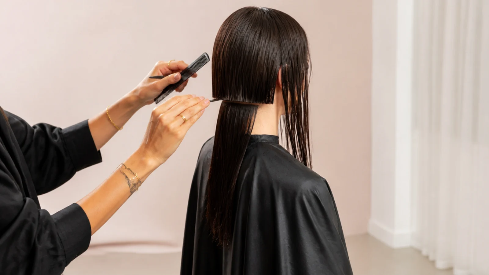 A dried head being checked with a comb and scissors for final adjustments