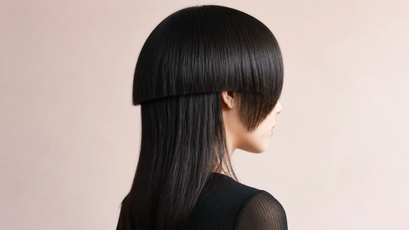 Bangs meeting in a soft downward point at the centre of the forehead