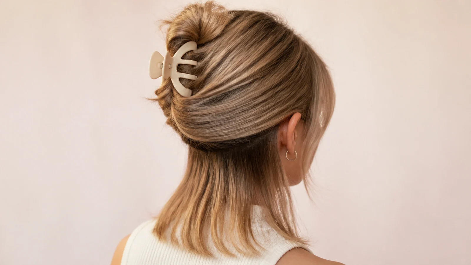Long lengths twisted into a claw clip with the short layer left down