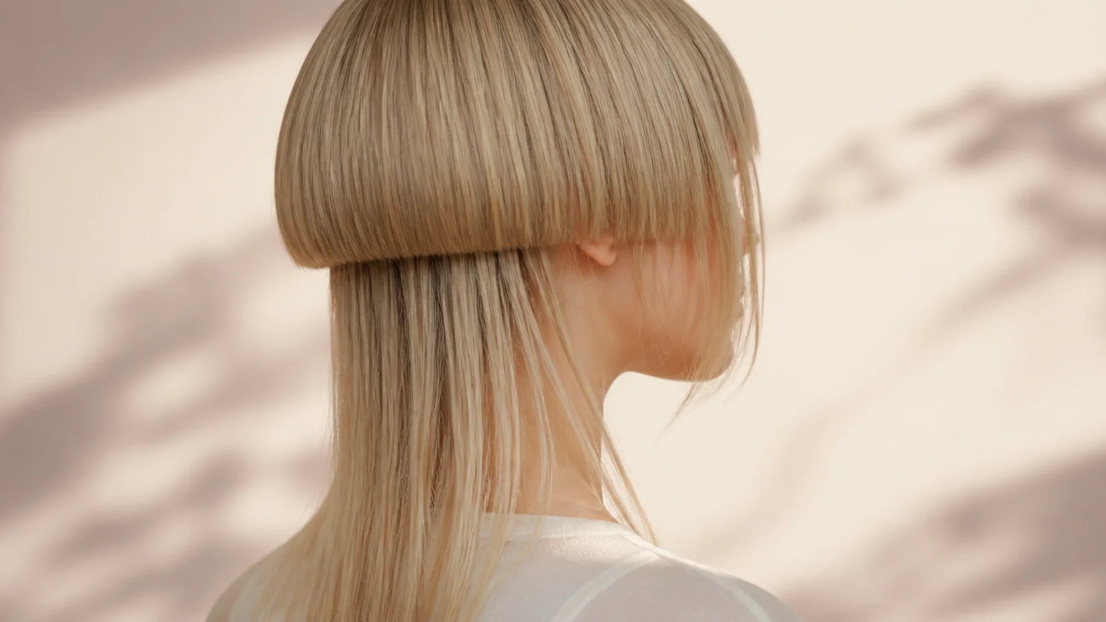 A solid bell on fine straight hair with light catching the cut line