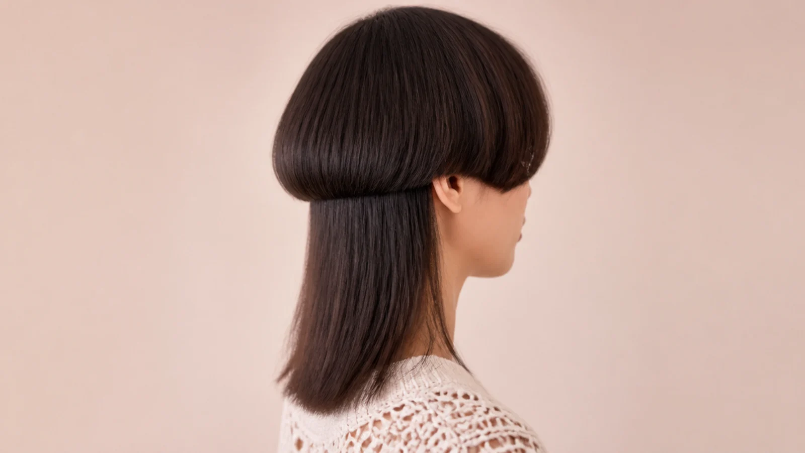 A very short bell at ear level with hair falling to the bra strap