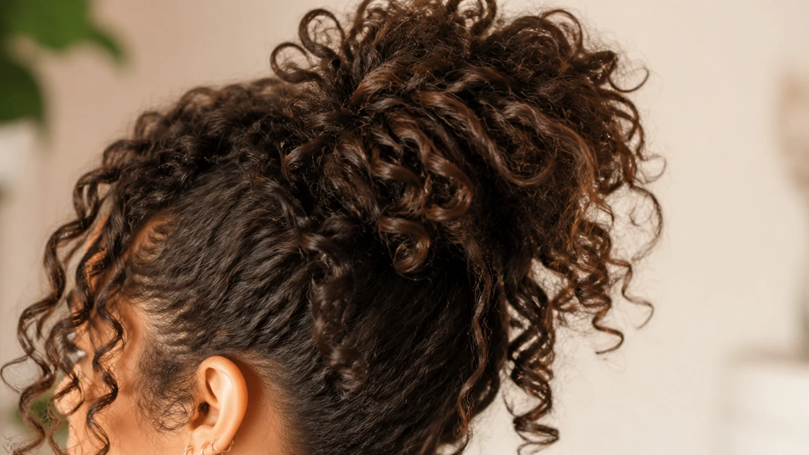 Curls gathered loosely on top of the head with the pattern left uncompressed