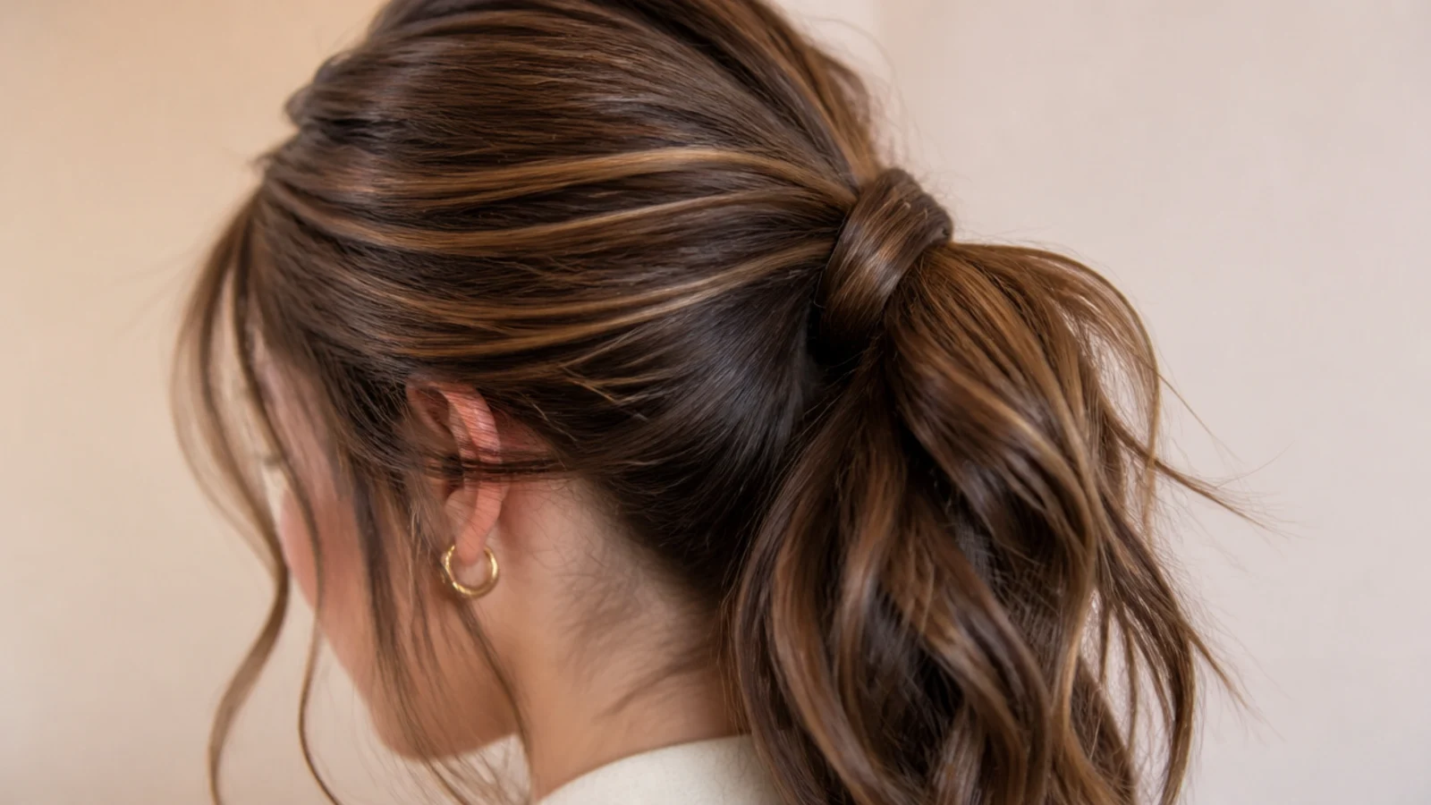 A ponytail with a smoothed root and a deliberately rough tail