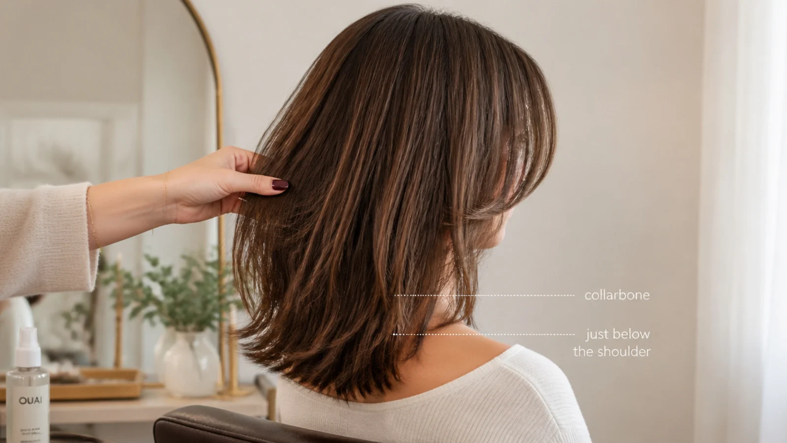 Hair falling to the collarbone with a soft fringe parted at the centre