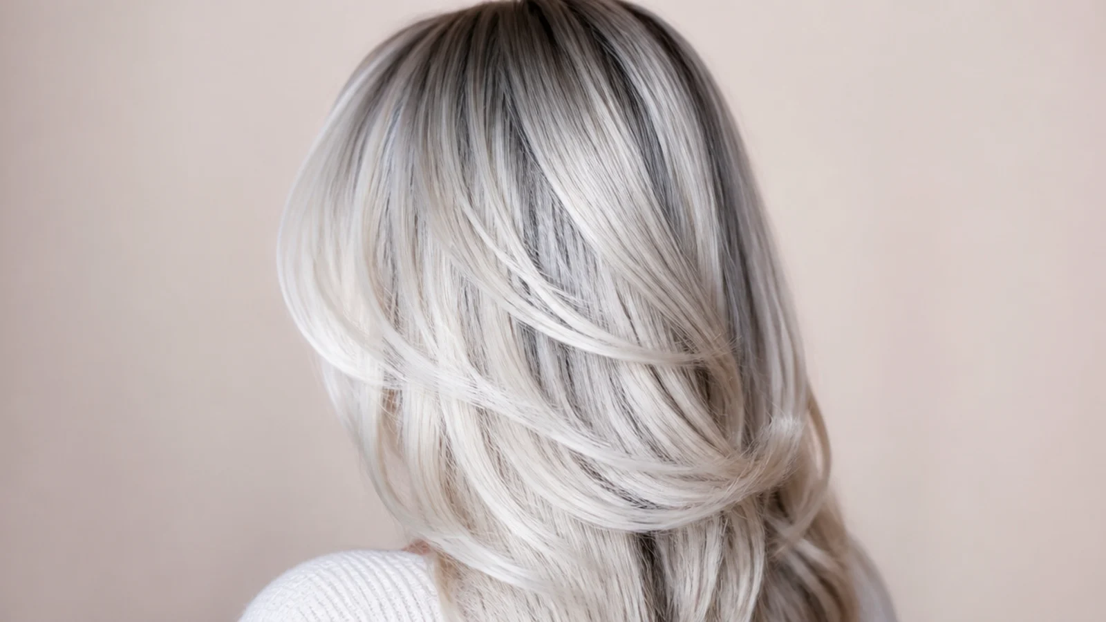 Ash blonde hair with a faint silver blue cast through the lengths