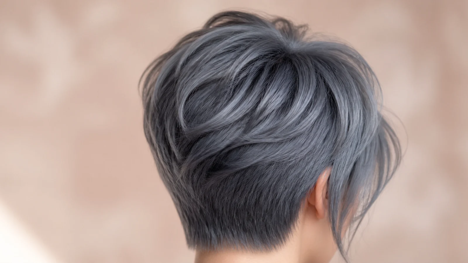 A cropped pixie in a smoky gray blue with textured ends