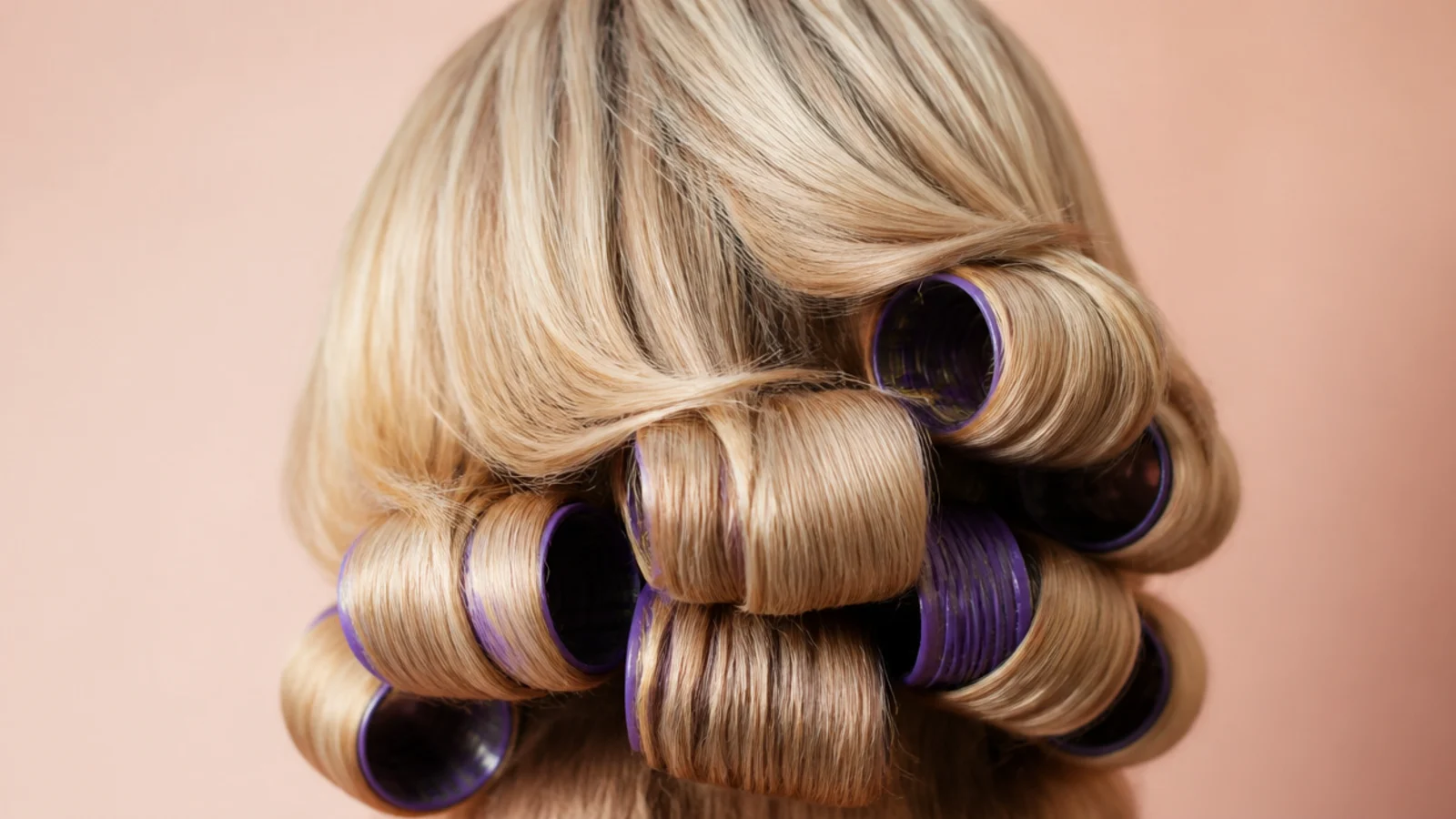 Colored foam rods wound through damp sections of hair