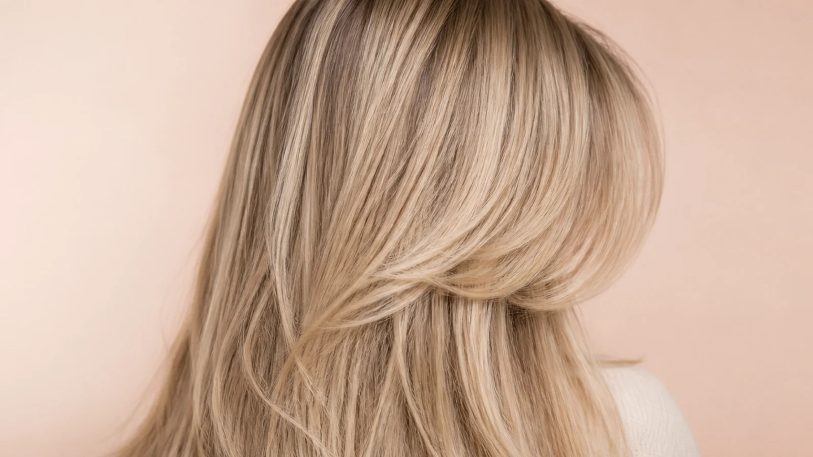 A soft fringe falling to lash level either side of a centre part