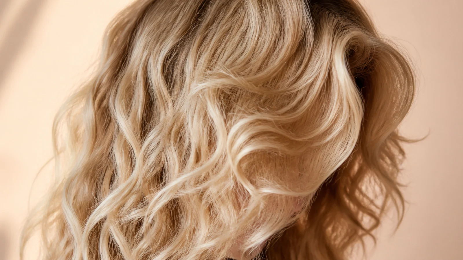 Loose spiral curls with a soft curtain fringe framing the face