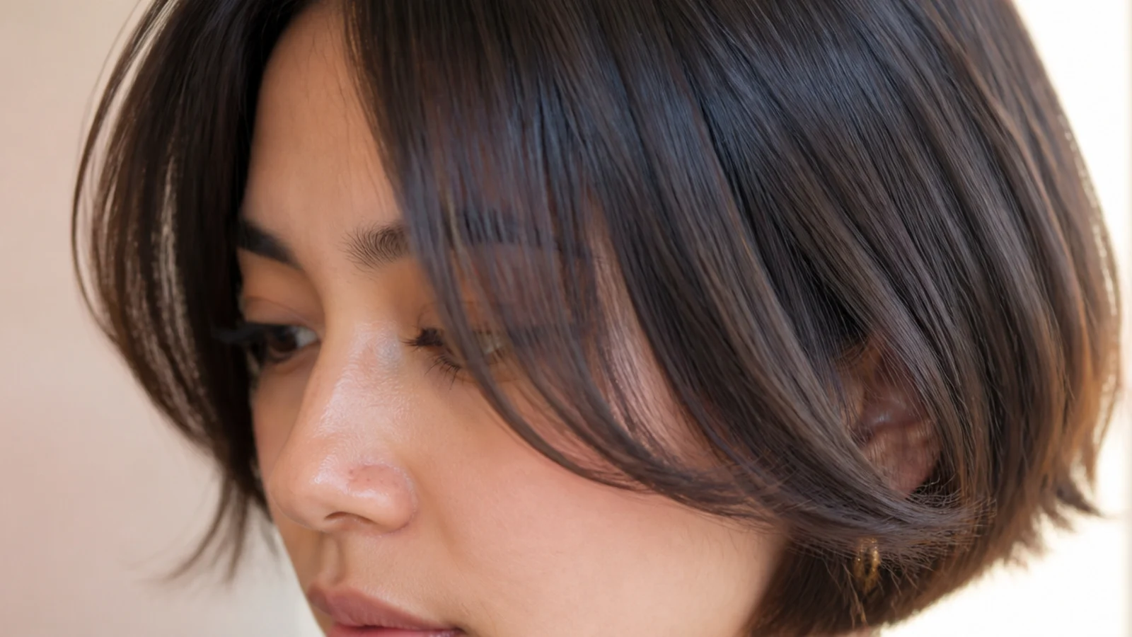 A chin length bob with a short parted fringe at three weeks