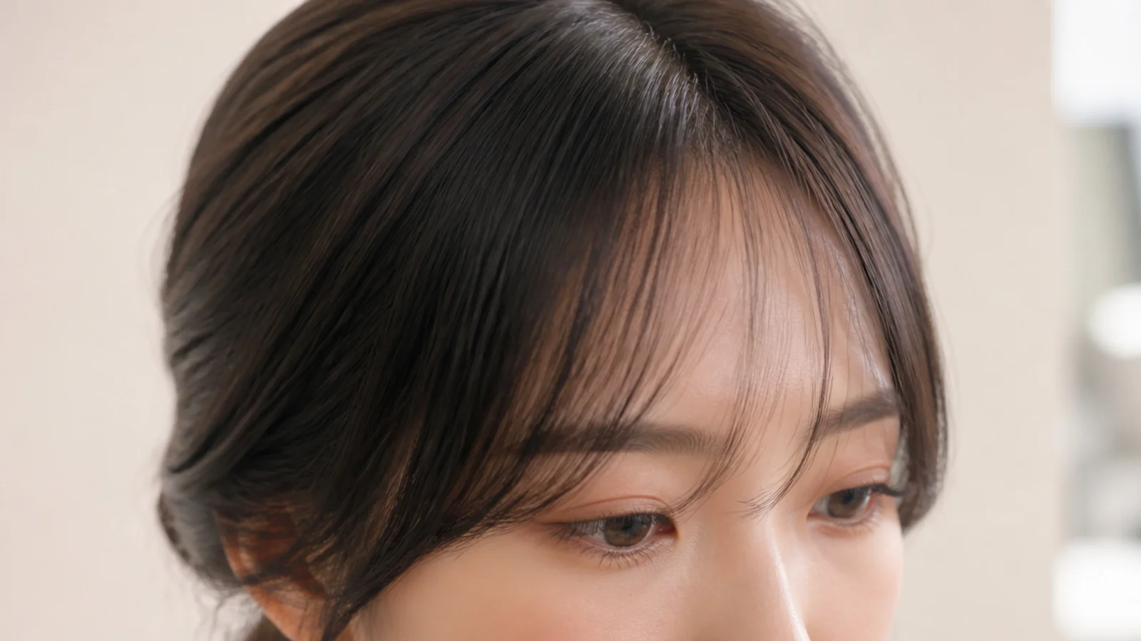 A very light fringe with visible gaps showing the forehead behind it