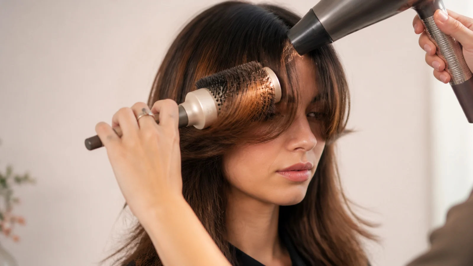 A round brush and dryer shaping one half of a fringe
