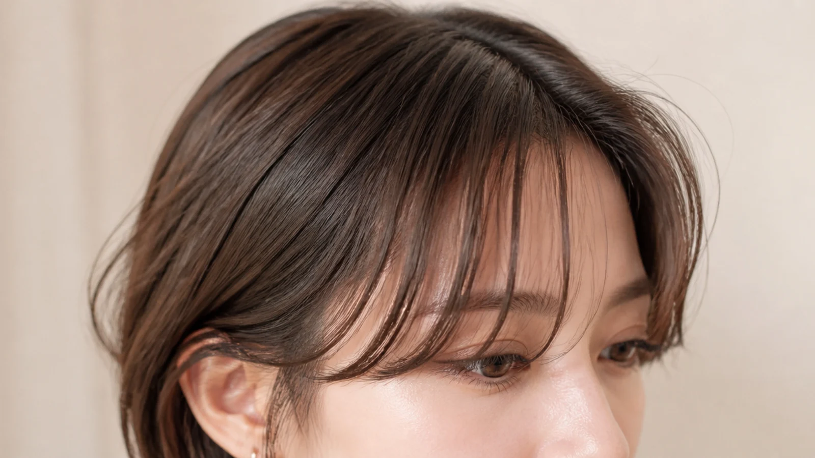 Fine wavy hair with a light see-through fringe and a visible centre parting