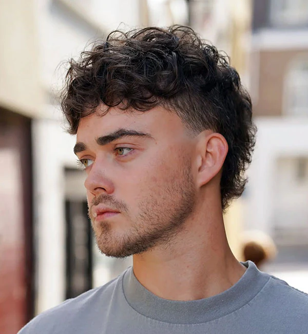 Messy Curly Mohawk with Taper Fade
