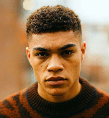 Thick, Black Curls with Mid Fade