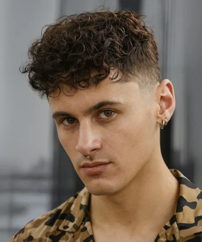 Curly Caesar haircut with natural texture and tapered sides
