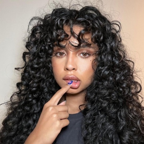 Voluminous Curls With Bangs
